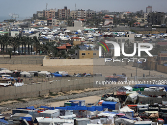 Palestinians are taking shelter in a tent camp in Deir Balah in the central Gaza Strip on April 24, 2024, after fleeing their homes due to I...