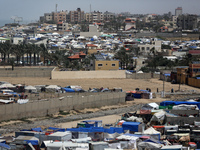 Palestinians are taking shelter in a tent camp in Deir Balah in the central Gaza Strip on April 24, 2024, after fleeing their homes due to I...