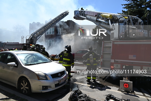 The Chicago Fire Department is responding to a heavy fire in a building on South Kostner Avenue in Chicago, Illinois, United States, on Apri...