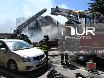 The Chicago Fire Department is responding to a heavy fire in a building on South Kostner Avenue in Chicago, Illinois, United States, on Apri...