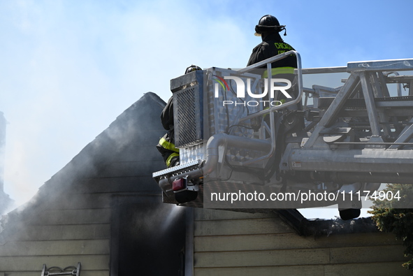 The Chicago Fire Department is responding to a heavy fire in a building on South Kostner Avenue in Chicago, Illinois, United States, on Apri...