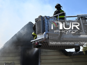 The Chicago Fire Department is responding to a heavy fire in a building on South Kostner Avenue in Chicago, Illinois, United States, on Apri...