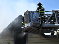 The Chicago Fire Department is responding to a heavy fire in a building on South Kostner Avenue in Chicago, Illinois, United States, on Apri...