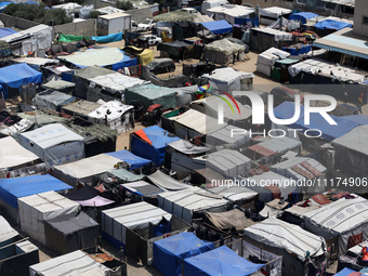 Palestinians are taking shelter in a tent camp in Deir Balah in the central Gaza Strip on April 24, 2024, after fleeing their homes due to I...