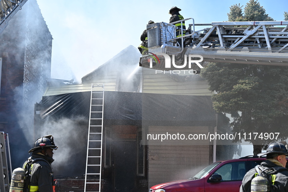 The Chicago Fire Department is responding to a heavy fire in a building on South Kostner Avenue in Chicago, Illinois, United States, on Apri...