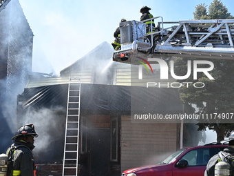 The Chicago Fire Department is responding to a heavy fire in a building on South Kostner Avenue in Chicago, Illinois, United States, on Apri...