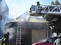 The Chicago Fire Department is responding to a heavy fire in a building on South Kostner Avenue in Chicago, Illinois, United States, on Apri...