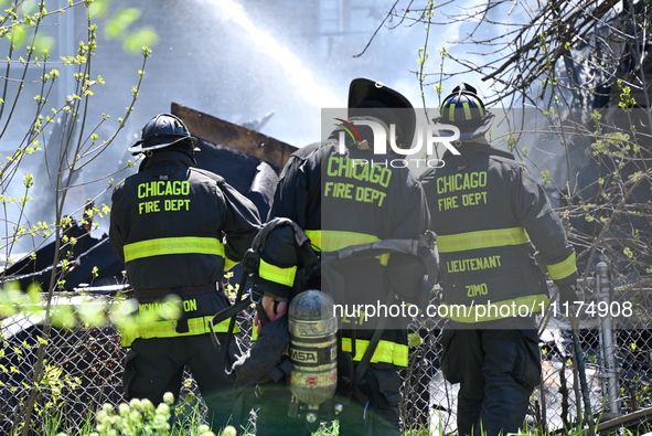 The Chicago Fire Department is responding to a heavy fire in a building on South Kostner Avenue in Chicago, Illinois, United States, on Apri...