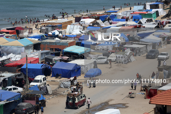 Palestinians are taking shelter in a tent camp in Deir Balah in the central Gaza Strip on April 24, 2024, after fleeing their homes due to I...