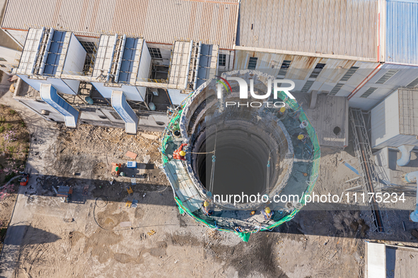 An aerial photo is showing the demolition of a chimney at the Thermal Company in Jiuquan, Gansu Province, China, on April 20, 2024. 