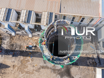 An aerial photo is showing the demolition of a chimney at the Thermal Company in Jiuquan, Gansu Province, China, on April 20, 2024. (