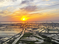 A wind farm is being seen at sunset in Wuxi, China, on April 24, 2024. (