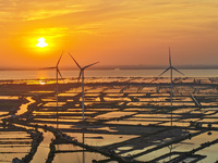 A wind farm is being seen at sunset in Wuxi, China, on April 24, 2024. (