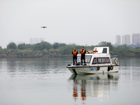 Fishing officials are driving a boat and using a drone to conduct a no-fishing inspection in the Shunqing section of the Jialing River in Na...