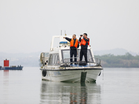 Fishing officials are driving a boat and using a drone to conduct a no-fishing inspection in the Shunqing section of the Jialing River in Na...