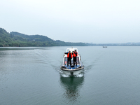 Fishing officials are driving a boat and using a drone to conduct a no-fishing inspection in the Shunqing section of the Jialing River in Na...