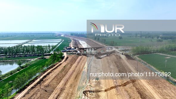 Workers are reinforcing beaches and embankments in Suqian, Jiangsu Province, China, on April 25, 2024. 