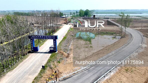 Workers are reinforcing beaches and embankments in Suqian, Jiangsu Province, China, on April 25, 2024. 