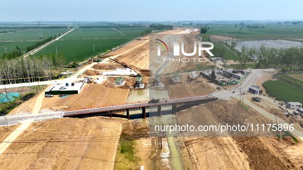 Workers are reinforcing beaches and embankments in Suqian, Jiangsu Province, China, on April 25, 2024. 