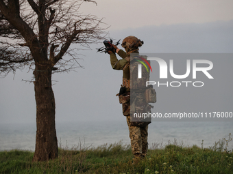 A soldier from a mobile air defense unit of the Armed Forces of Ukraine is working in the Odesa region, southern Ukraine, on April 24, 2024....