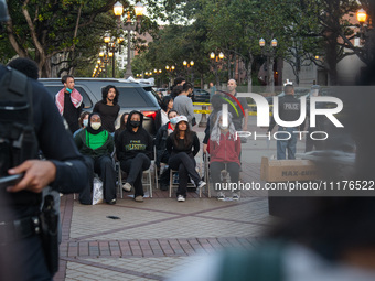 Pro-Palestine protesters are attempting to establish an occupation in Alumni Park on the University of Southern California campus in Los Ang...