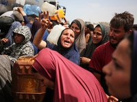 Displaced Palestinians are lining up to fill their containers with water in Deir Balah in the central Gaza Strip on April 25, 2024, amid ong...