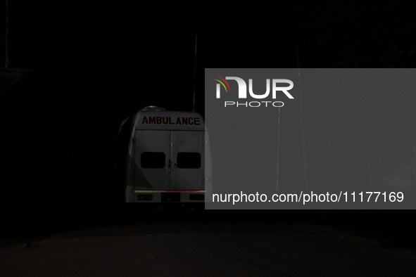 An ambulance is seen near the encounter site where a conflict is ongoing between militants and security forces in Nowpora, Sopore District,...