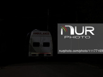 An ambulance is seen near the encounter site where a conflict is ongoing between militants and security forces in Nowpora, Sopore District,...