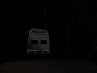 An ambulance is seen near the encounter site where a conflict is ongoing between militants and security forces in Nowpora, Sopore District,...