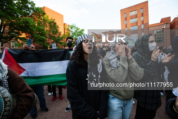 People rally at the encampment for Palestine set up by George Washington University students earlier in the day, in conjunction with other D...