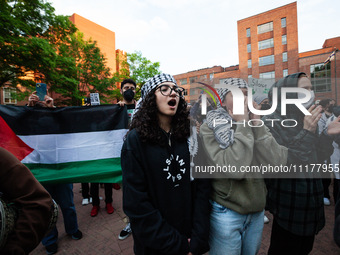 People rally at the encampment for Palestine set up by George Washington University students earlier in the day, in conjunction with other D...