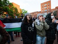 People rally at the encampment for Palestine set up by George Washington University students earlier in the day, in conjunction with other D...