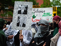 People rally at the encampment for Palestine set up by George Washington University students earlier in the day, in conjunction with other D...