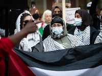 People rally at an encampment for Palestine set up by George Washington University students earlier in the day, in conjunction with other DC...