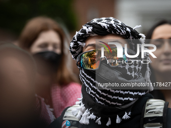 A demonstrator's sunglasses reflect the surrounding rally at an encampment for Palestine set up by George Washington University students in...