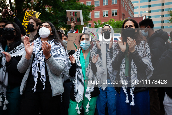 People rally at an encampment for Palestine set up by George Washington University students earlier in the day, in conjunction with other DC...