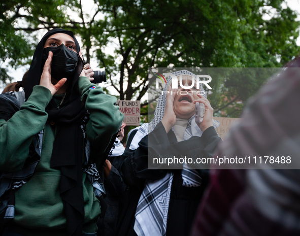 People rally at an encampment for Palestine set up by George Washington University students, in conjunction with other DC-area universities,...