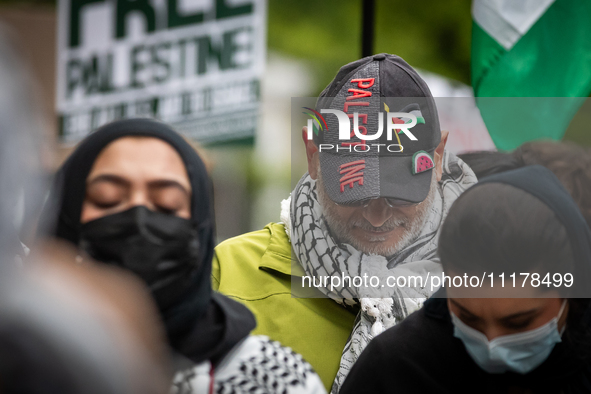 People rally at an encampment for Palestine set up by George Washington University students earlier in the day, in conjunction with other DC...