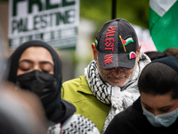 People rally at an encampment for Palestine set up by George Washington University students earlier in the day, in conjunction with other DC...