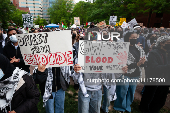 Thousands of people rally at an encampment for Palestine set up by George Washington University students in conjunction with other DC-area u...