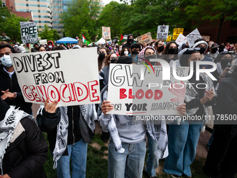 Thousands of people rally at an encampment for Palestine set up by George Washington University students in conjunction with other DC-area u...