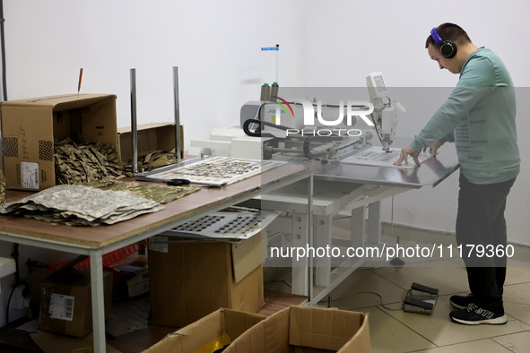 An employee is working in headphones at the Dzhavelina factory, which is manufacturing backpacks for the military in the Ivano-Frankivsk Reg...