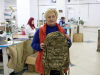 An employee is showing a backpack for the military at the Dzhavelina factory in Ivano-Frankivsk Region, Ukraine, on April 25, 2024. NO USE R...