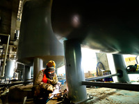 Construction workers are welding a pipeline at the construction site of the Zhangye Waste Disposal and Resource Utilization Center in Zhangy...