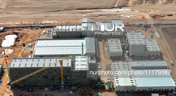 An aerial view is showing the construction project of the Zhangye Hazardous Waste (solid waste) disposal and resource utilization Center in...