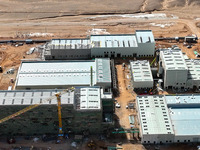 An aerial view is showing the construction project of the Zhangye Hazardous Waste (solid waste) disposal and resource utilization Center in...