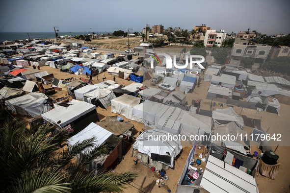 Palestinians are taking shelter in a tent camp in Deir Balah in the central Gaza Strip on April 26, 2024, as they flee their homes due to Is...