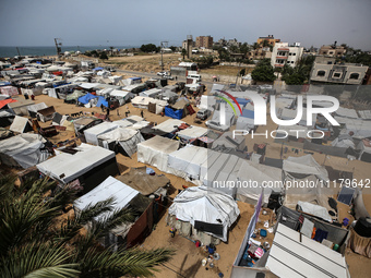 Palestinians are taking shelter in a tent camp in Deir Balah in the central Gaza Strip on April 26, 2024, as they flee their homes due to Is...