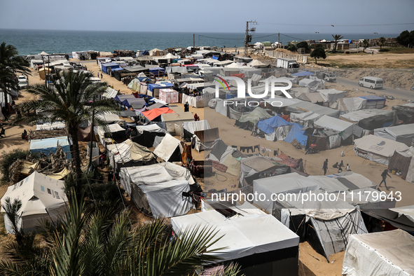 Palestinians are taking shelter in a tent camp in Deir Balah in the central Gaza Strip on April 26, 2024, as they flee their homes due to Is...