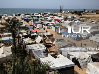 Palestinians are taking shelter in a tent camp in Deir Balah in the central Gaza Strip on April 26, 2024, as they flee their homes due to Is...